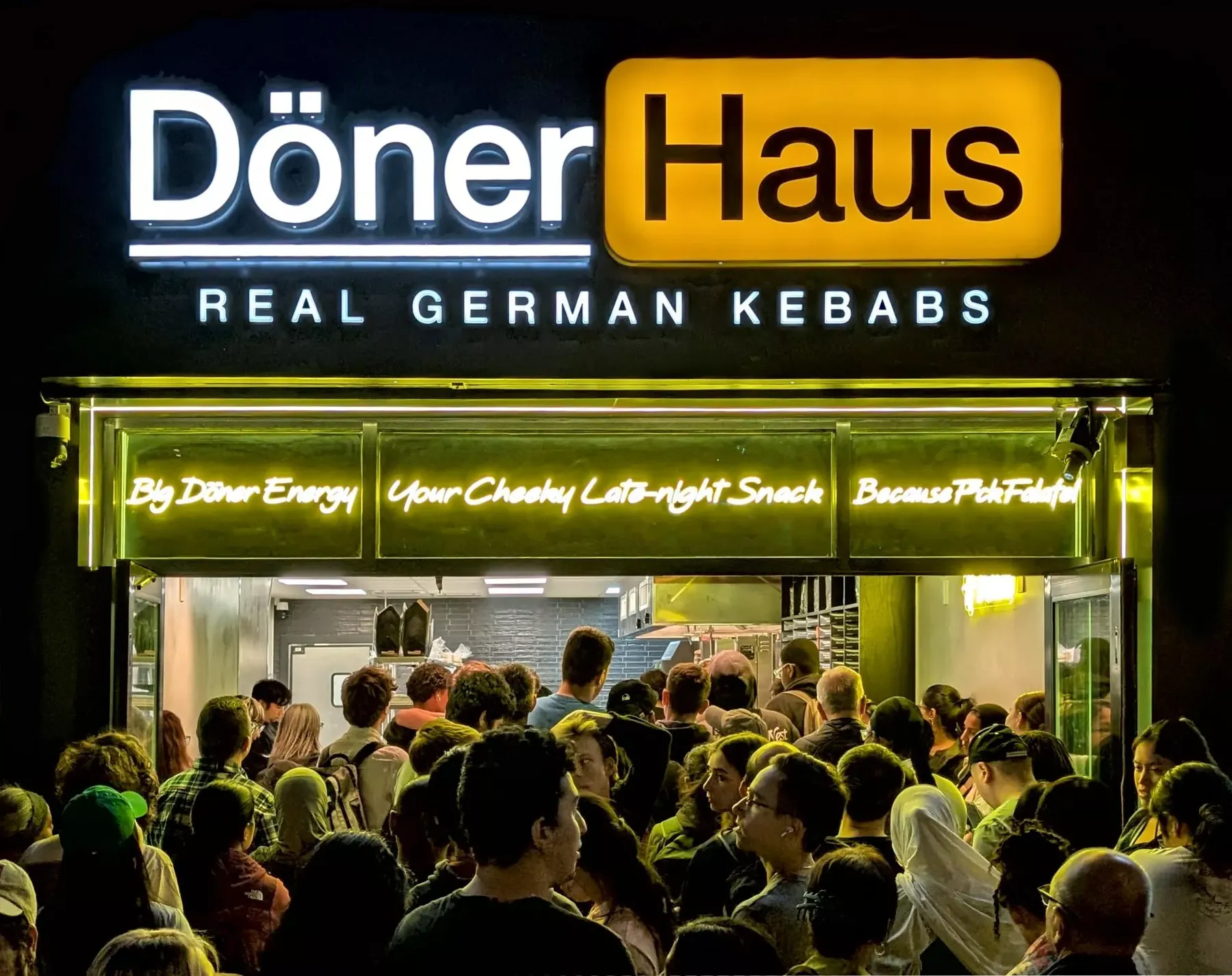 A queue packed into a small döner shop