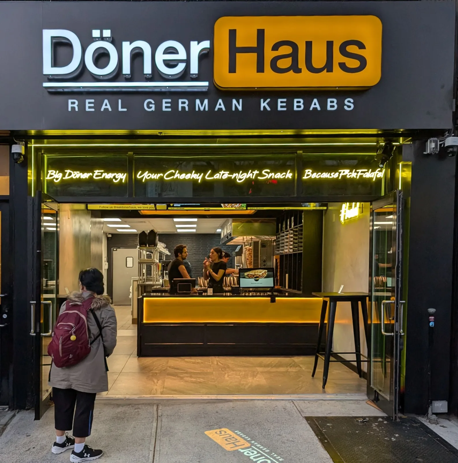 A German döner storefront on a New York street with customers outside