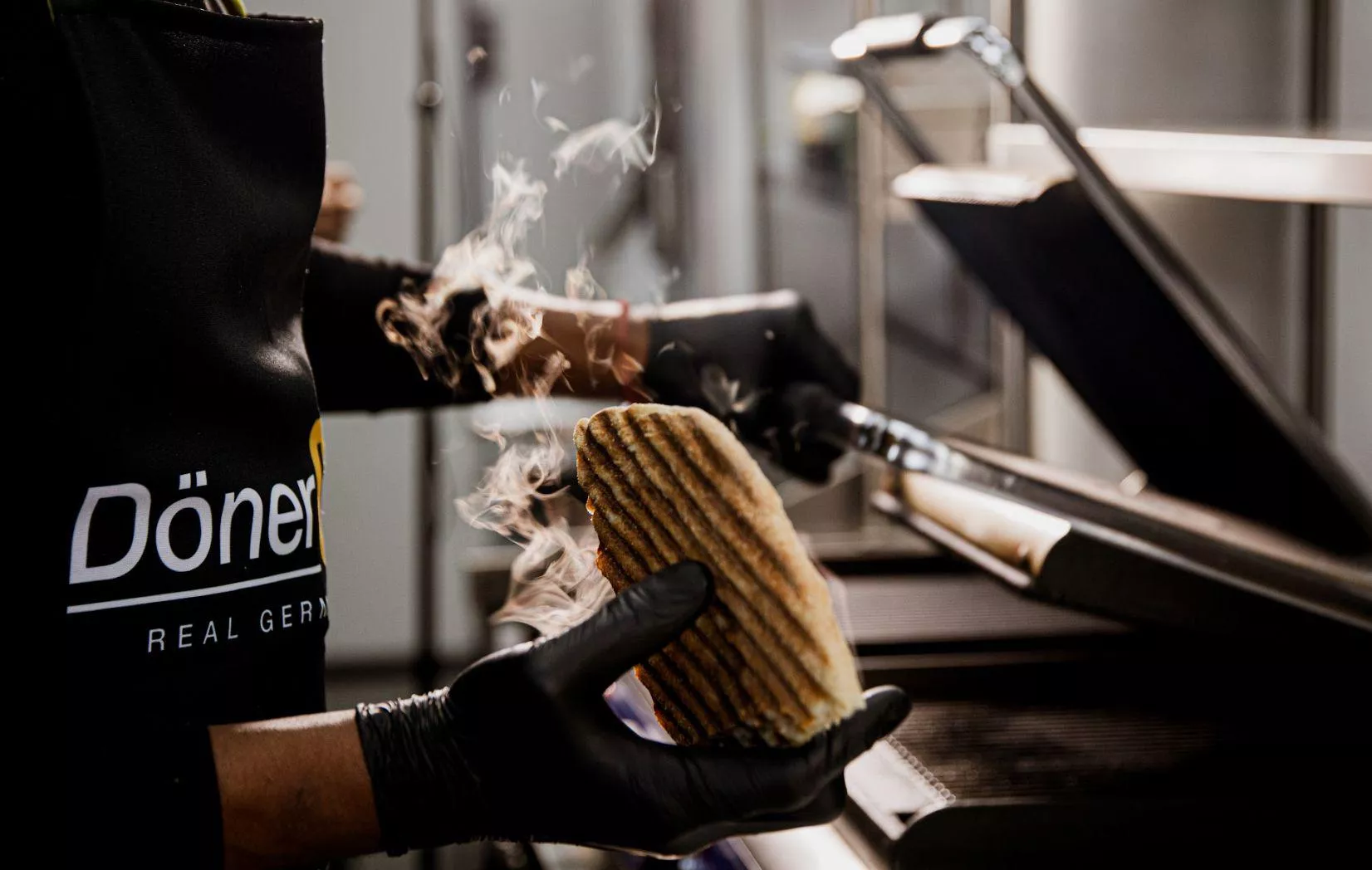Flatbread toasting on the grill in a döner shop